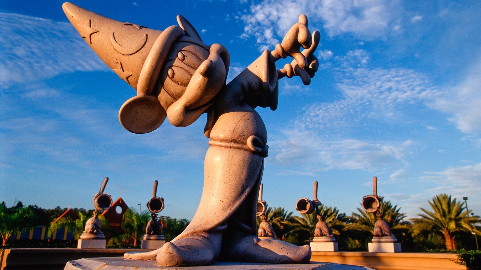 statue of sorcerer mickey mouse with blue sky